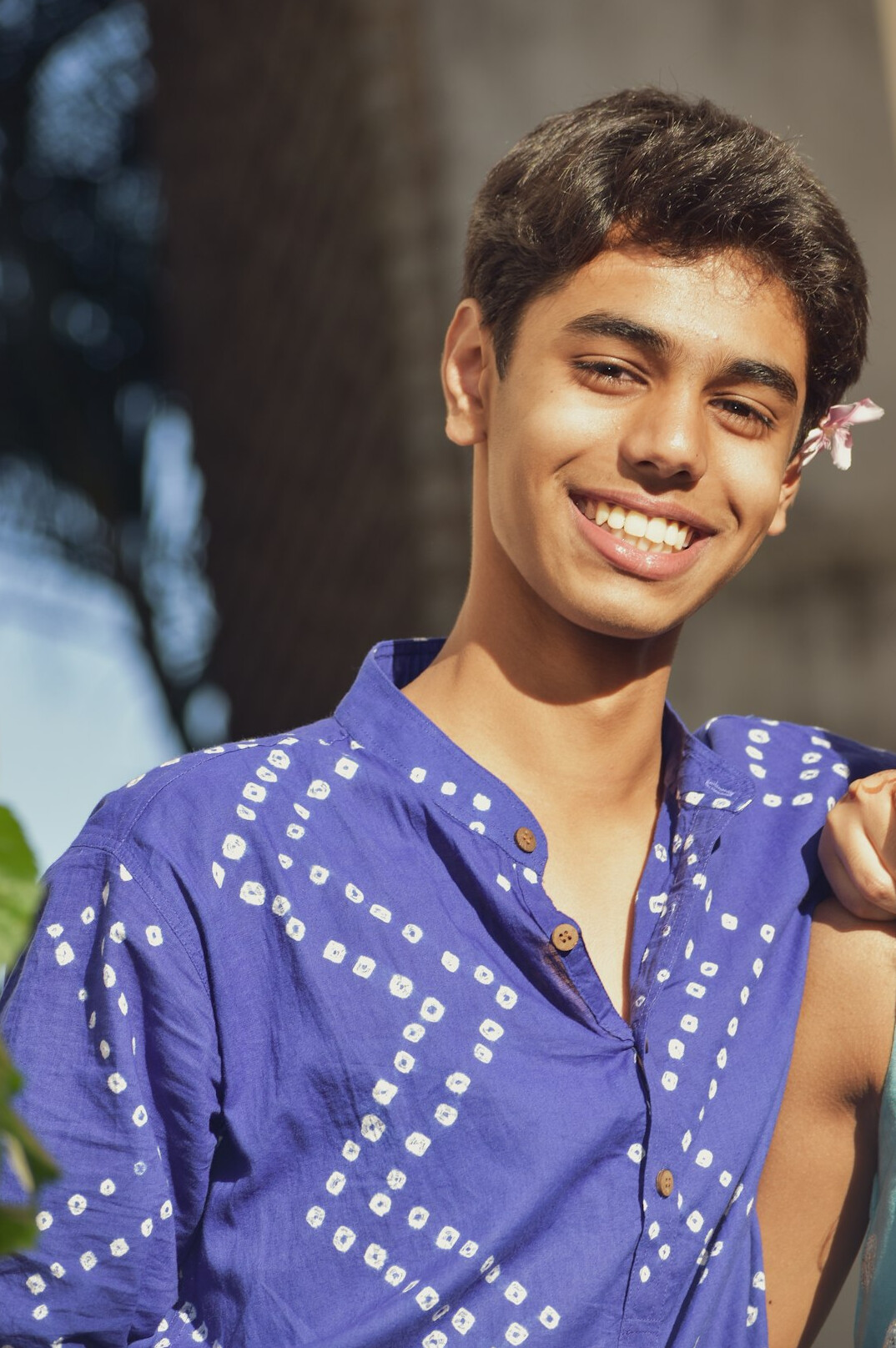 Portrait of a young man in a shirt smiling