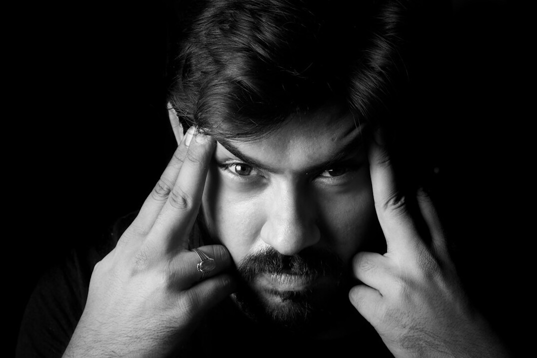 Portrait of a bearded man with a calm expression