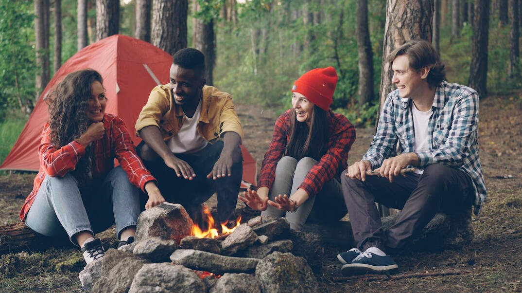 Friends laughing together outdoors